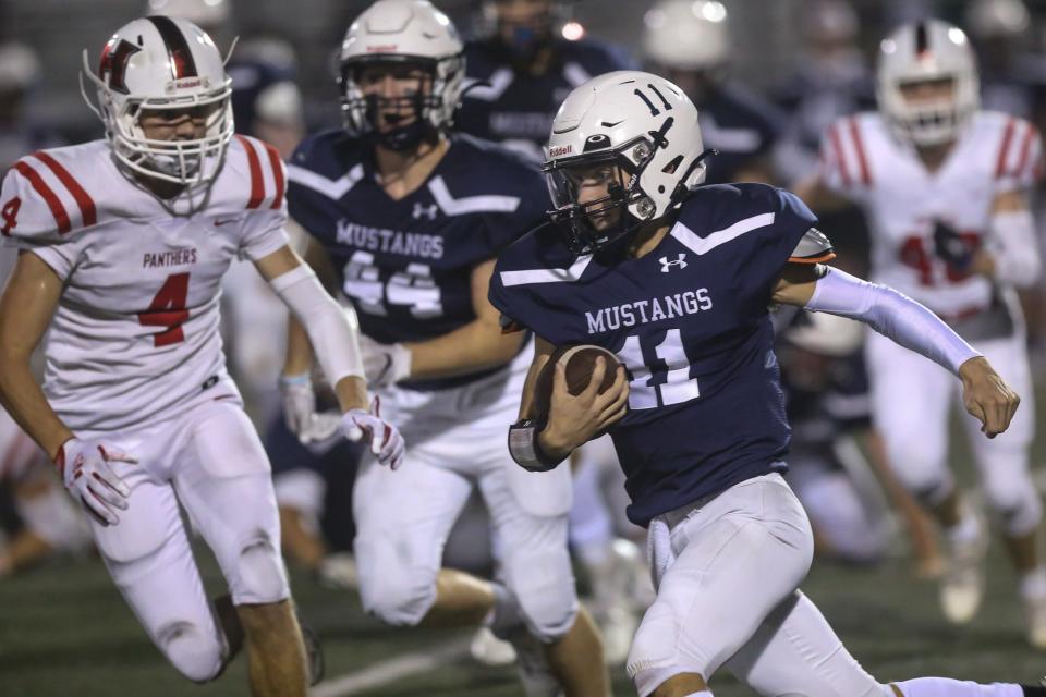 Medway’s Luke Frauton runs the ball during the football against Holliston at Medway High School on Sep. 17, 2021.