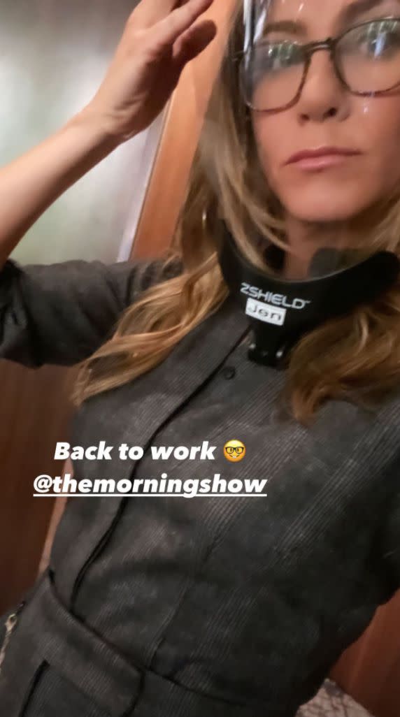 Jennifer Aniston snapped a selfie while back on set for "The Morning Show," wearing a face shield against the spread of coronavirus, on Tuesday, Dec. 1, 2020.