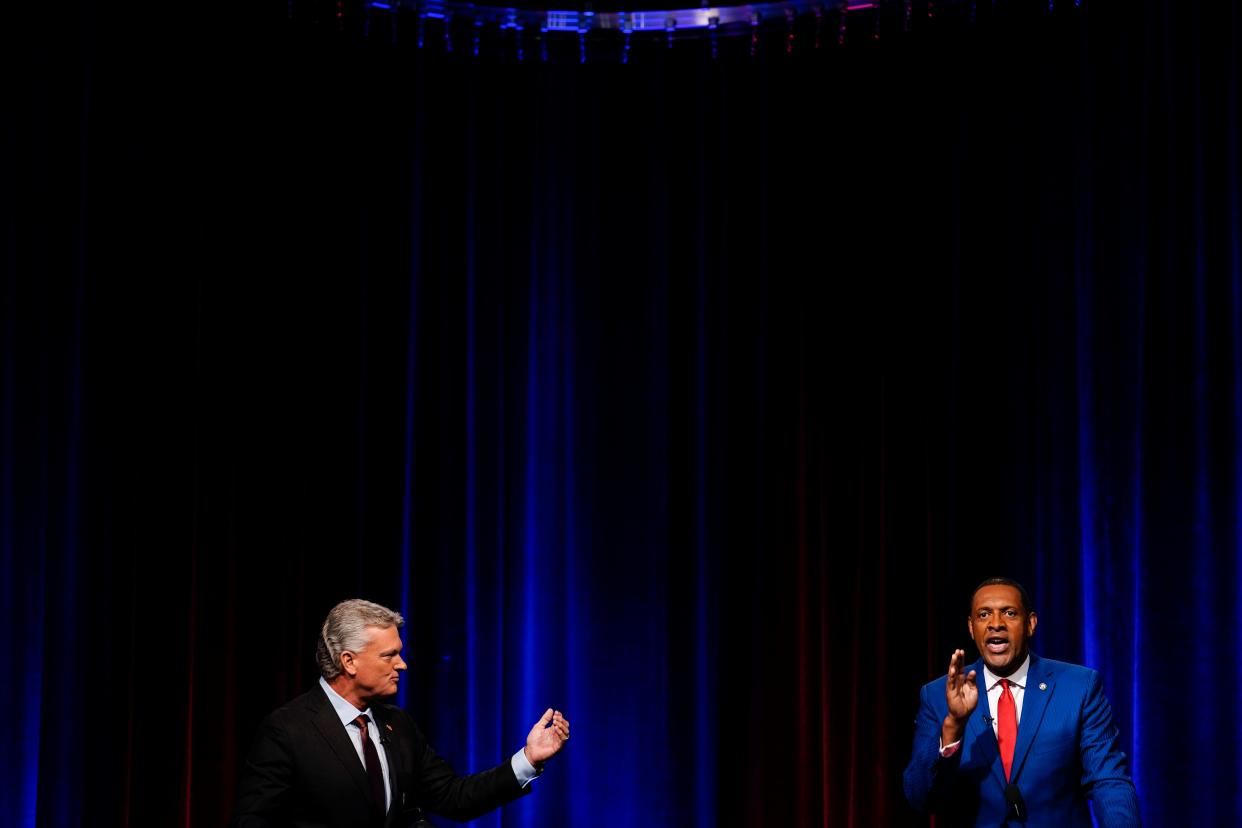 Mike Collins, left, and Vernon Jones participate in Georgia's 10th Congressional District Republican primary election runoff debates on Monday, June 6, 2022, in Atlanta. (AP Photo/Brynn Anderson)