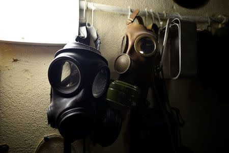 Gasmasks which were used during the "Troubles" and collected by William Jackson, hang in the tower in the walled-off loyalist Protestant enclave called The Fountain situated within the city of Londonderry, Northern Ireland, September 12, 2017. REUTERS/Clodagh Kilcoyne