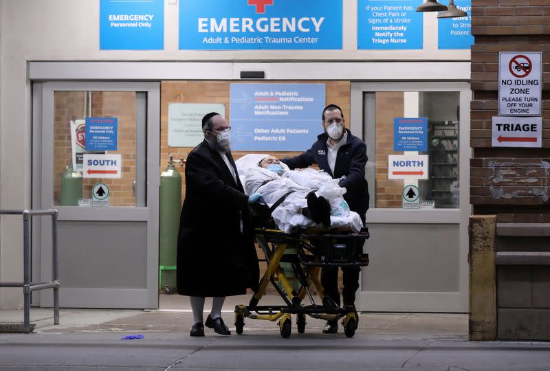 A man is wheeled on a stretcher at Maimonides Medical Center during the outbreak of the coronavirus disease (COVID19) in the Brooklyn borough of New York