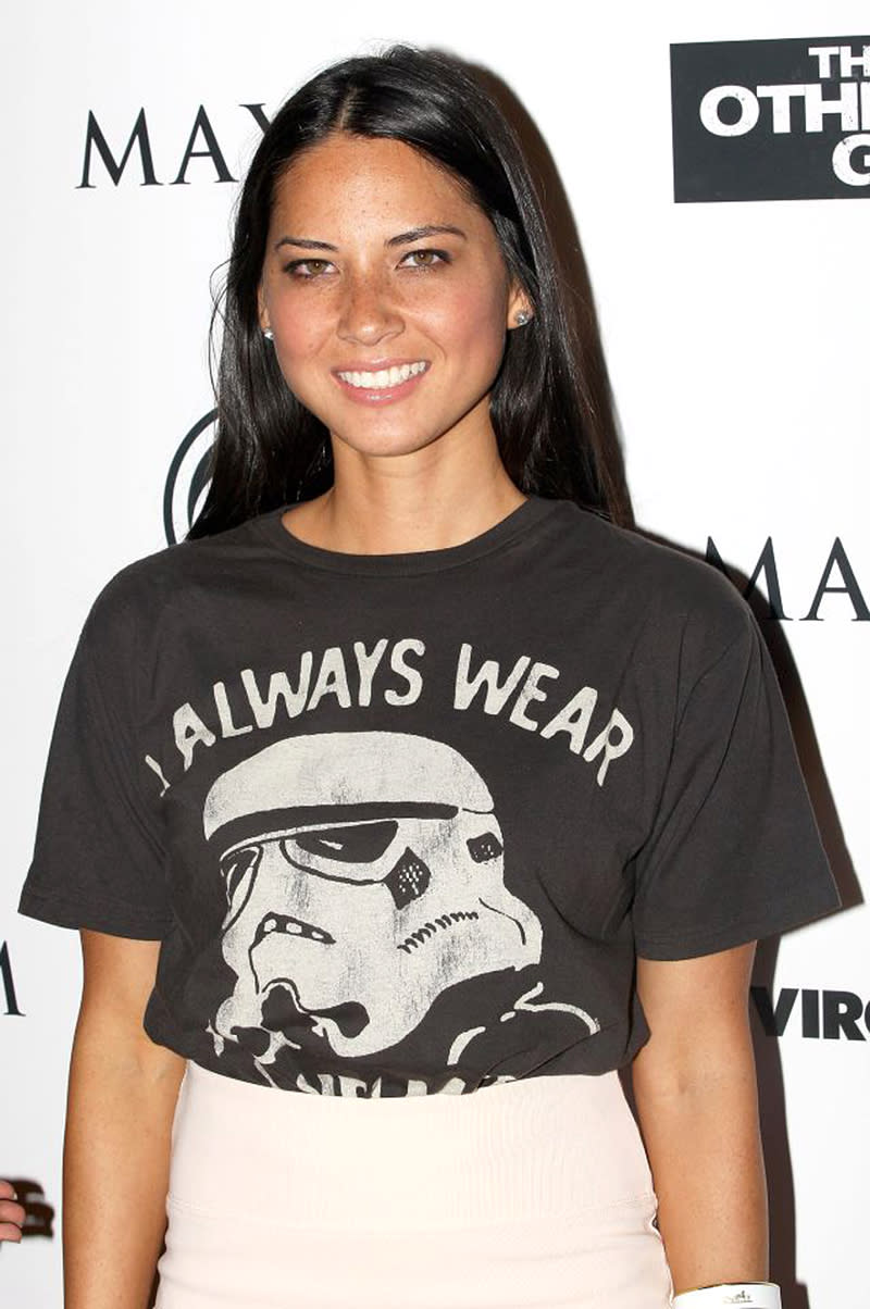<p>No wonder Munn’s been called “Hollywood’s hottest geek.” The former <em>Newsroom</em> star was also snapped in a Darth Vader shirt at a movie premiere during Comic-Con in San Diego. (Photo: Getty Images) </p>