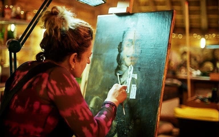 Lucia Scalisi, the show’s painting conservator, cleans and restores the work - BBC