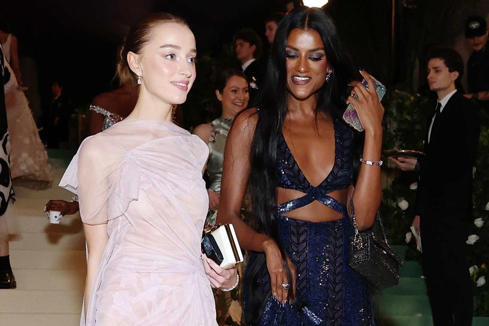 <p>Cindy Ord/MG24/Getty</p> Phoebe Dynevor and Simone Ashley attend The 2024 Met Gala Celebrating Sleeping Beauties: Reawakening Fashion at The Metropolitan Museum of Art on May 06, 2024 in New York City.  