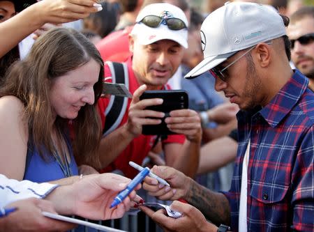 Formula One - F1 - Italian Grand Prix 2016 - Monza, Italy - 02/9/16 - Mercedes' Lewis Hamilton of Britain signs autographs before the first free practice. REUTERS/Max Rossi