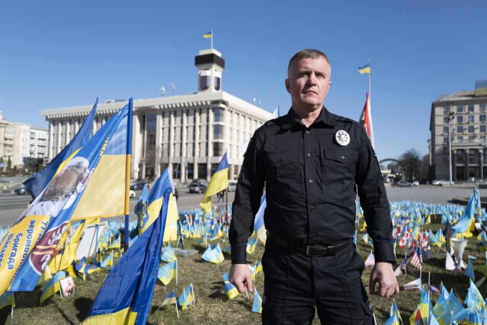 Ukrainian police officer Volodymyr Nikulin poses for a photo in downtown Kyiv, Monday March 11, 2024. Nikulin helped Associated Press journalists during the siege of Mariupol, in the early days of Russia's invasion of Ukraine in 2022, while filming "20 Days in Mariupol" which won the best documentary Oscar on Sunday night. (AP Photo/Bela Szandelszky)