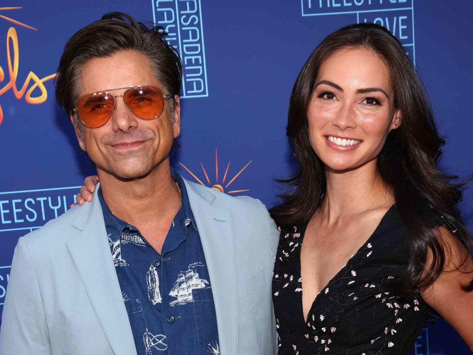 <p>David Livingston/Getty</p> John Stamos and wife Caitlin Hughes