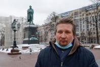 Participant of rally in support of Russian opposition politician Alexei Navalny, Viktor Lipatov, poses in Moscow