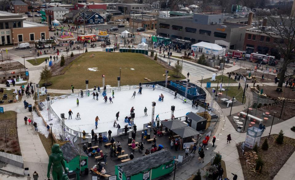 People flock to downtown Royal Oak during the Winter Blast Royal Oak on Saturday, Feb. 3, 2024. The weekend-long event features outdoor activities and vendors, including food trucks, ice sculptures, live music, an ice garden, ice skating, e-sports, food, and more.