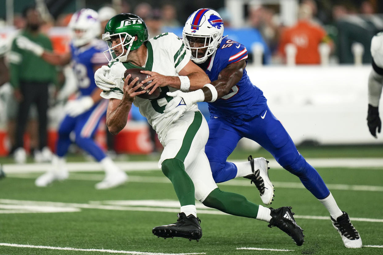 New York Jets quarterback Aaron Rodgers (8) is sacked by Buffalo Bills defensive end Leonard Floyd (56) during the first quarter of an NFL football game, Monday, Sept. 11, 2023, in East Rutherford, N.J. (Seth Wenig / AP)