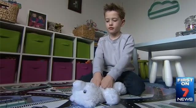 Ethan practising CPR on his teddy bear. Source: 7News