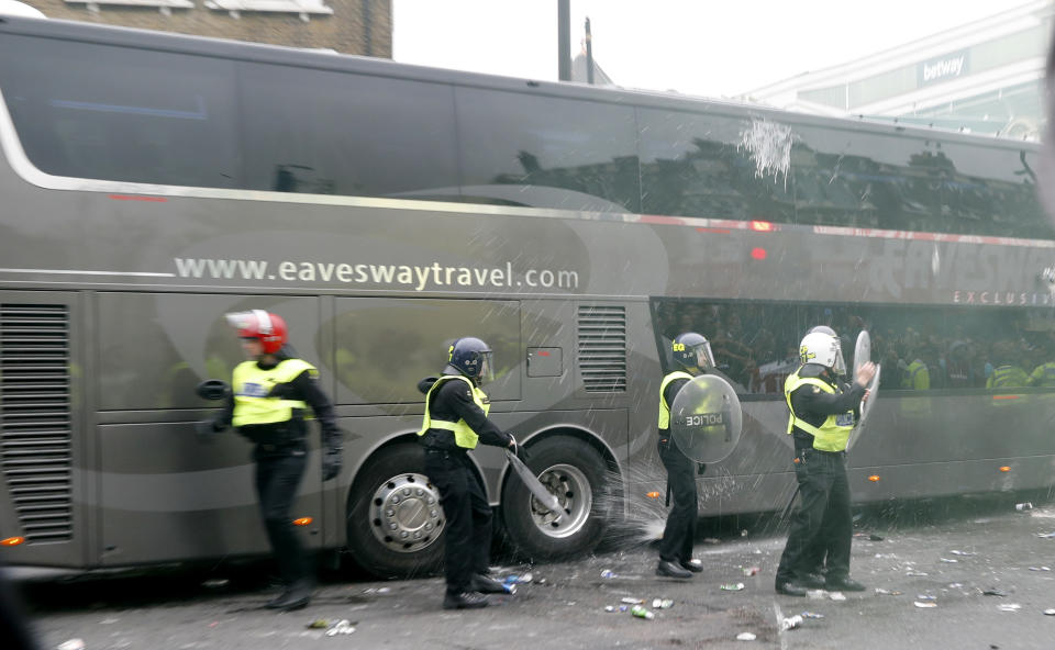 Britain Soccer Football - West Ham United v Manchester United - Barclays Premier League - Upton Park - 10/5/16 Bottles are thrown at the Manchester United team bus before the match Reuters / Eddie Keogh Livepic EDITORIAL USE ONLY. No use with unauthorized audio, video, data, fixture lists, club/league logos or "live" services. Online in-match use limited to 45 images, no video emulation. No use in betting, games or single club/league/player publications. Please contact your account representative for further details.