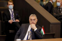 FILE - Hungarian Prime Minister Viktor Orban, center, attends a NATO leaders virtual summit at NATO headquarters in Brussels, Feb. 25, 2022. Orban, has nurtured close political and economic ties with Russia for more than a decade. But following Russia's large-scale invasion of Ukraine, Hungary's neighbor, Orban is facing growing pressure to change course. (AP Photo/Olivier Matthys, File)