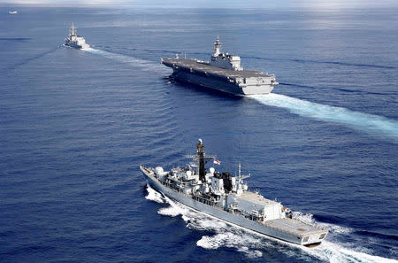 British frigate HMS Argyle (front), Japanese helicopter carrier Kaga (C) and Japanese destroyer Inazuma take part in a joint naval drill in the Indian Ocean, September 26, 2018. Picture taken on September 26, 2018. REUTERS/Kim Kyung-Hoon