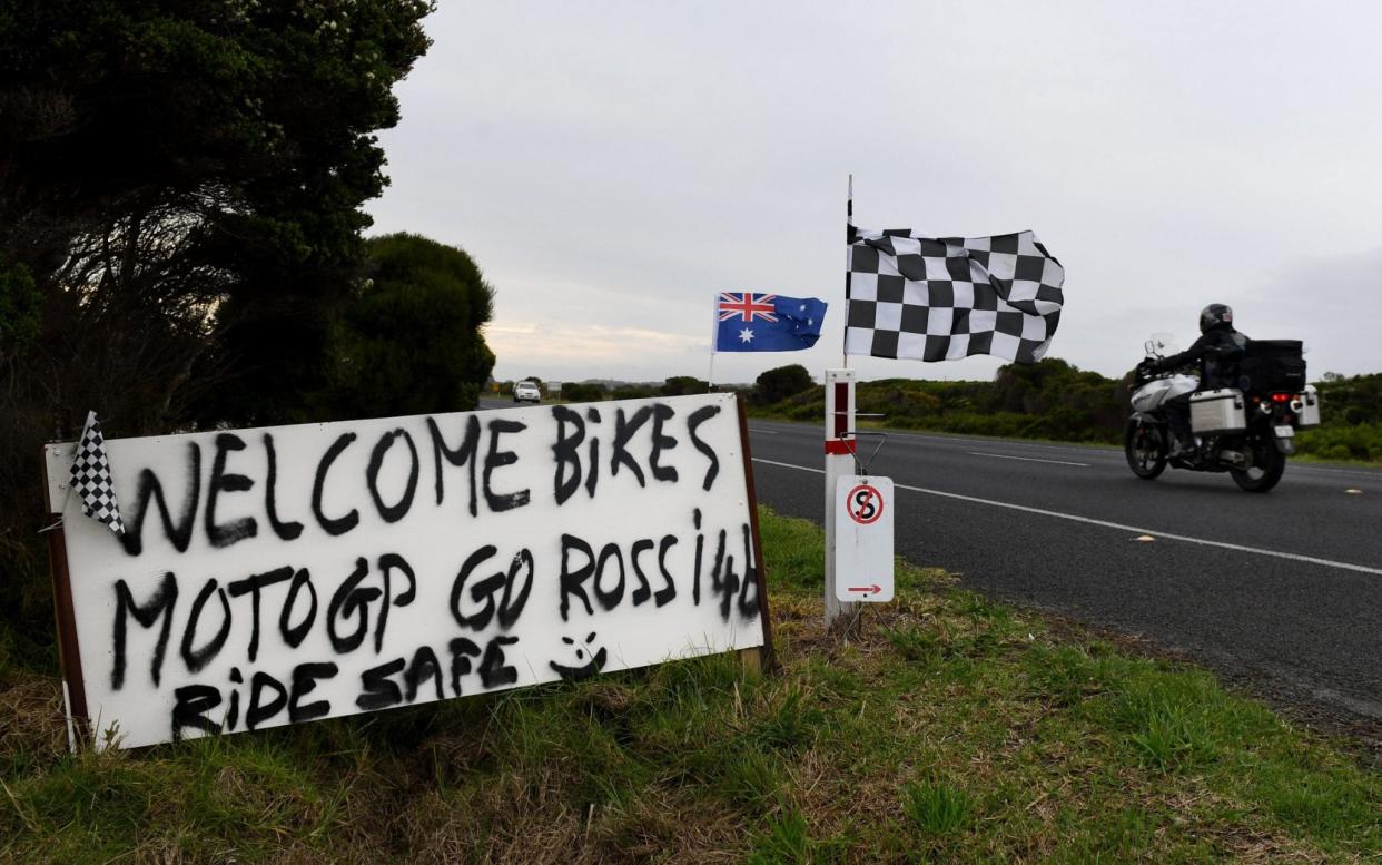 A sign created by Phillip Island local Jamie Rodger-Murray, who also mows a message in his lawn