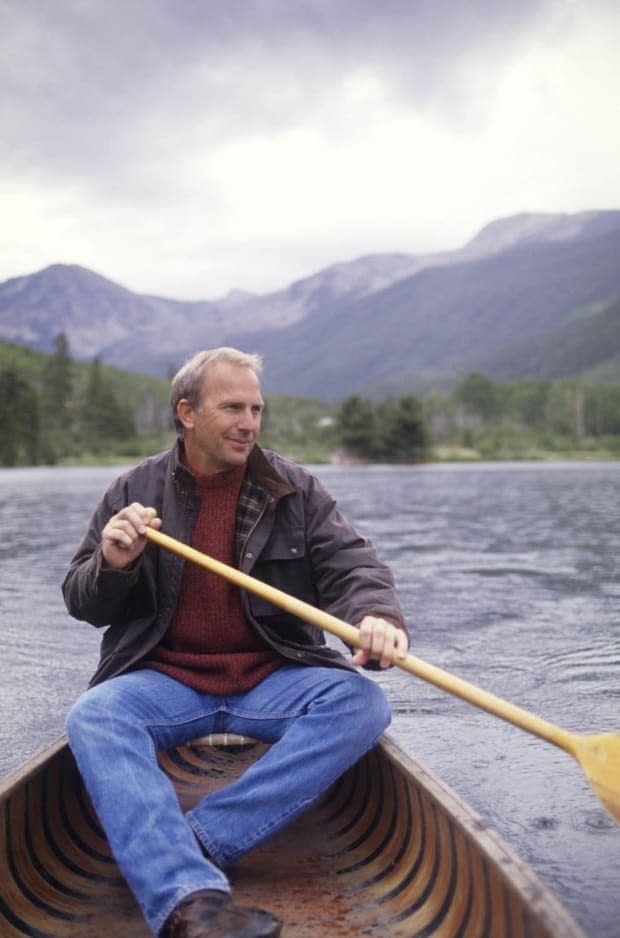 <p>Kevin Costner rows his canoe around the lake at his Aspen home. </p>