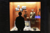 A visitor watches a Chinese military uniform and equipments used during the Korea War at the Korea War Memorial Museum in Seoul, South Korea, Friday, Oct. 23, 2020. Chinese leader Xi Jinping condemned "unilateralism, protectionism and extreme egoism" in a jab at the United States made during a rally Friday to mark the 70th anniversary of China's entry into the 1950-53 Korean War. (AP Photo/Ahn Young-joon)