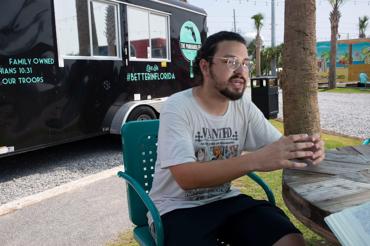 Gabriel Mason, owner of The Panhandler and Texan B's BBQ food trucks, describes his food concept on June 10. Mason is preparing to station the Texan B's BBQ on Woodbine Road in Pace.