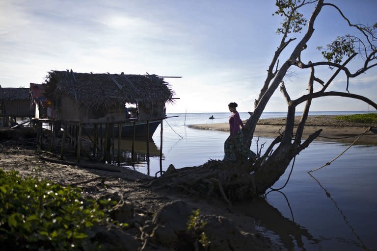 A resident walks in Tanjung Labian, near where Philippine militants have staked a territorial claim on February 21, 2013