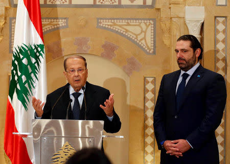 Christian politician and FPM founder Michel Aoun (L) talks during a news conference next to Lebanon's former prime minister Saad al-Hariri after he said he will back Aoun to become president in Beirut, Lebanon October 20, 2016. REUTERS/Mohamed Azakir