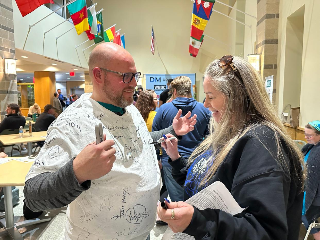 Illinois resident Jason Flick has others sign his t-shirt at an open casting call for CBS's hit reality television show "Survivor" on November 10, 2023, at Wor-Wic Community College in Salisbury, Maryland.