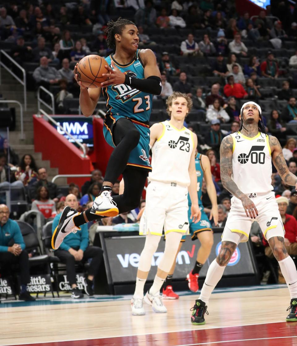 Detroit Pistons guard Jaden Ivey drives against Utah Jazz guard Jordan Clarkson (00) during third-period action Tuesday, Dec. 20, 2022.