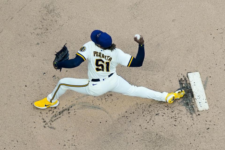 Milwaukee Brewers starting pitcher Freddy Peralta throws during the first inning of game 2 of a doubleheader baseball game against the San Francisco Giants Thursday, Sept. 8, 2022, in Milwaukee. (AP Photo/Morry Gash)