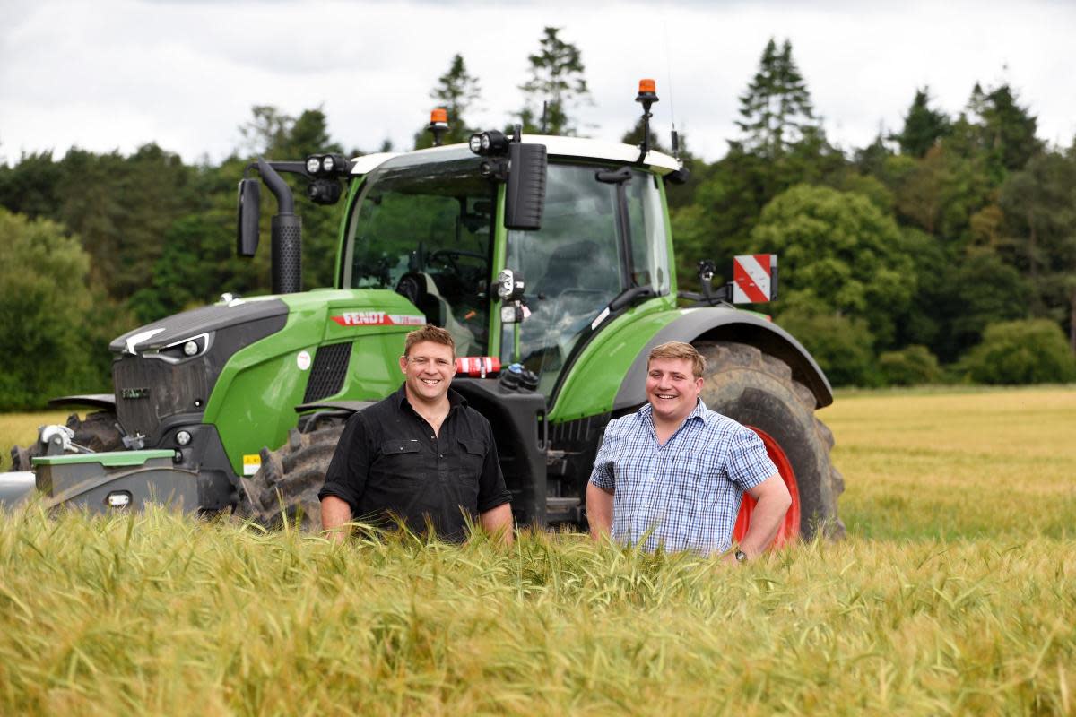 Tom Youngs (left) with his cousin George at the family's champion farm near Aylsham <i>(Image: Denise Bradley)</i>