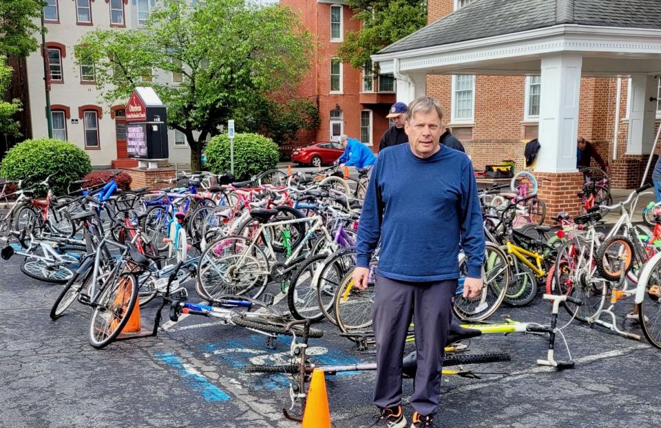 Mike Johnston, owner of M.S. Johnston. Co. and co-coordinator of Otterbein United Methodist Church's bike collection effort for Bikes for the World, at the church's 2023 annual collection event in the downtown Hagerstown church's parking lot.