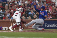St. Louis Cardinals catcher Yadier Molina, left, tags out Chicago Cubs' Willson Contreras during the sixth inning of a baseball game Wednesday, July 21, 2021, in St. Louis. (AP Photo/Joe Puetz)