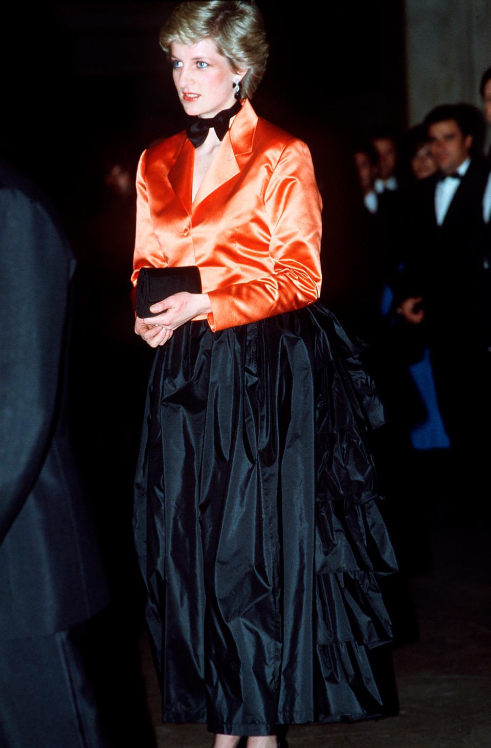 Princess Diana wears an orange tuxedo in February 1987.