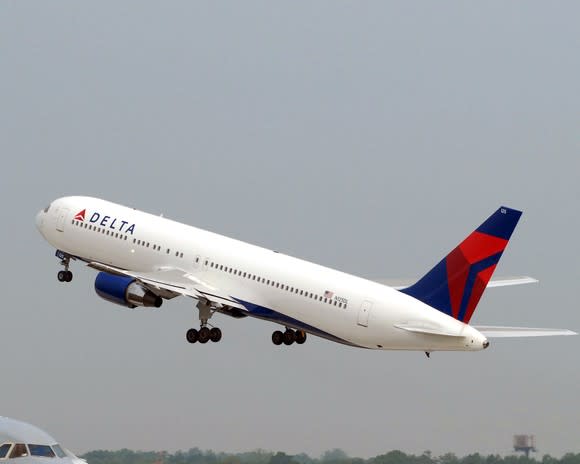 A Delta Air Lines 767-400ER jet taking off