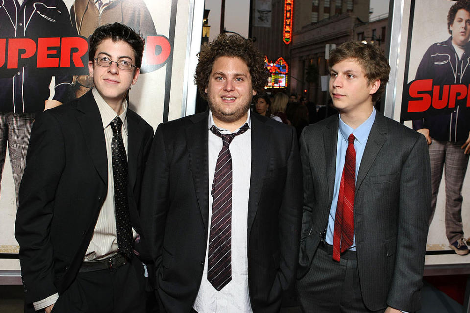 Christopher, Jonah, and Michael Cera in suits and ties standing together