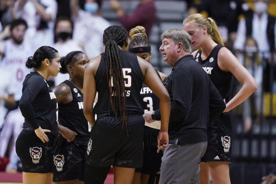 North Carolina State coach Wes Moore talks with the team during the second half of an NCAA college basketball game against Indiana, Thursday, Dec. 2, 2021, in Bloomington, Ind. (Darron Cummings)