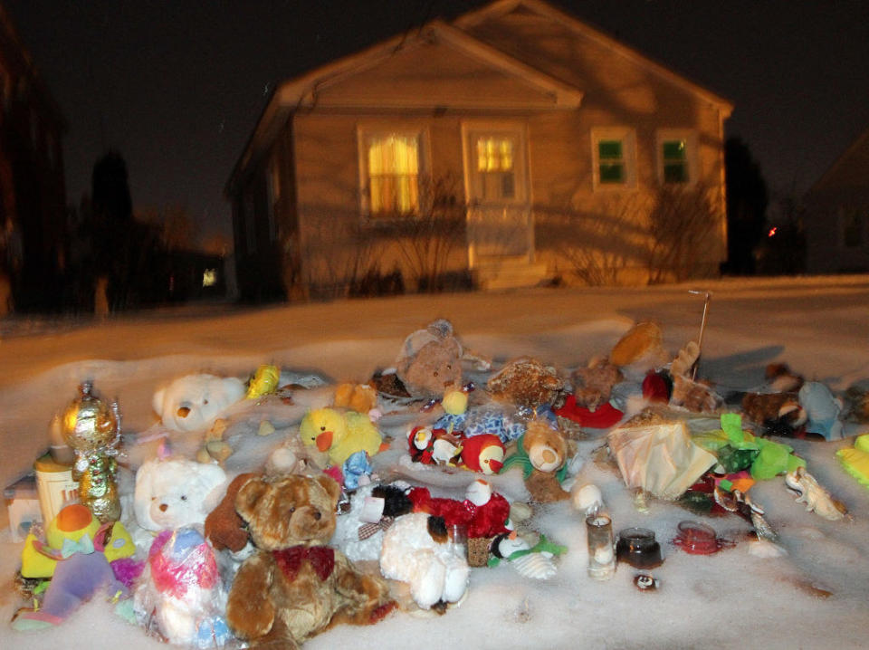 Stuffed animals are left in front of the house where Ayla Reynolds disappeared