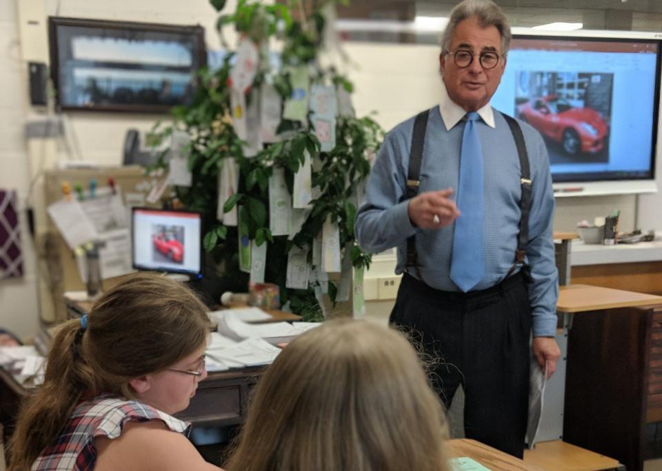 John Ninfo leads a school National CARE Financial Literacy Program discussion.