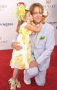 <p>As Dannielynn has grown older, her hair accessories have grown larger. In 2012, the pretty 5-year-old sported a floral look. Her headwear coordinated perfectly with her dress and sandals. (Photo: Michael Loccisano/Getty Images) </p>