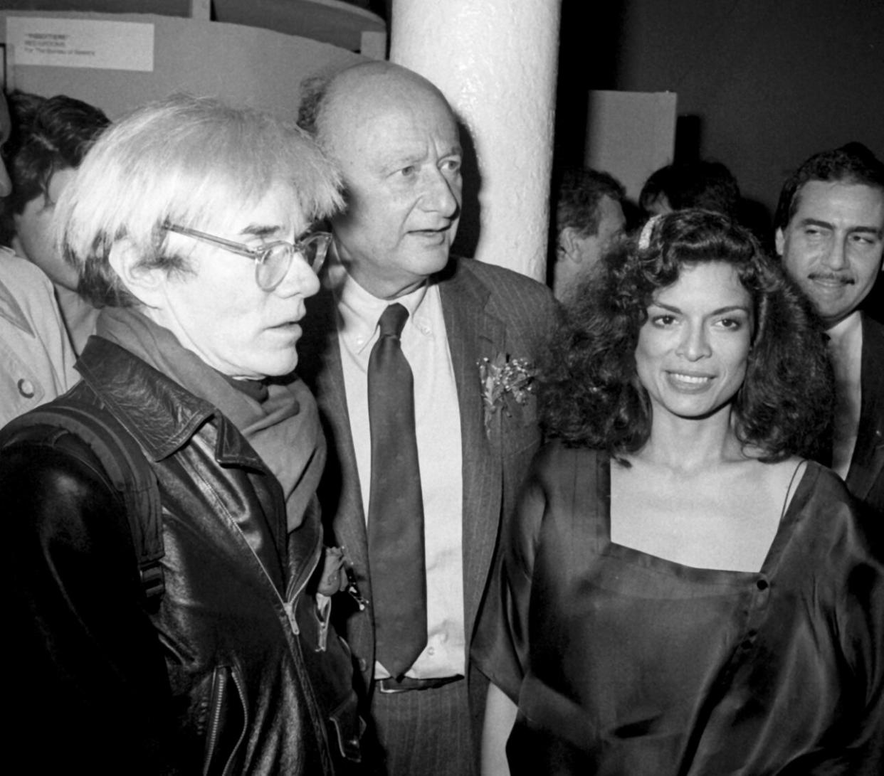 Polaroid philosopher Andy Warhol, city mayor Ed Koch, and Rolling Stones wife Bianca Jagger at Area Nightclub, New York City, 1984. (Credit: Ron Galella/Ron Galella Collection via Getty Images)