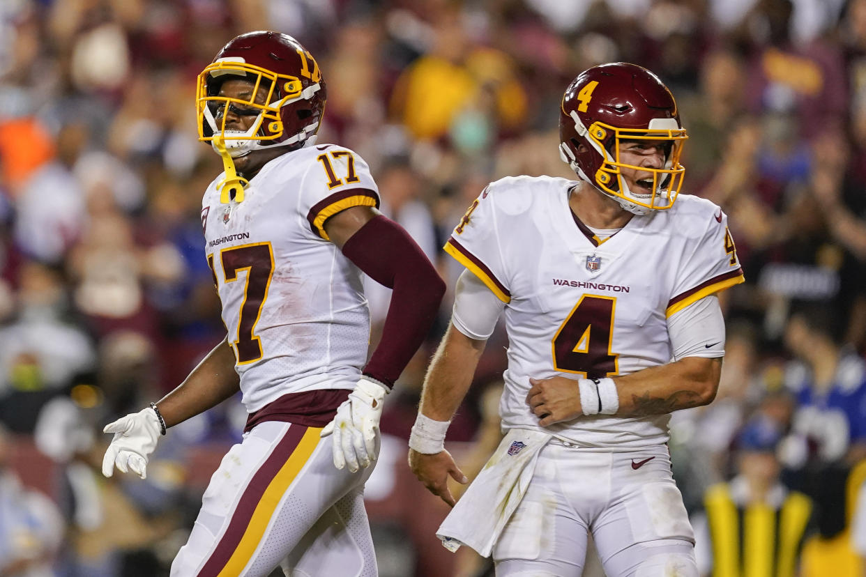 Washington Football Team wide receiver Terry McLaurin (17) and quarterback Taylor Heinicke (4) celebrate a touchdown. (AP Photo/Alex Brandon)