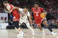 Wisconsin guard AJ Storr (2) works toward the basket as Illinois guard Terrence Shannon Jr. (0) defends during the first half of an NCAA college basketball game in the championship of the Big Ten Conference tournament, Sunday, March 17, 2024, in Minneapolis. (AP Photo/Abbie Parr)