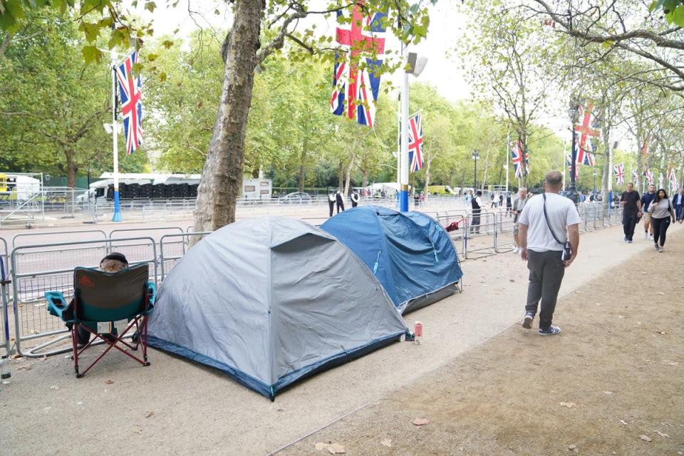 People have already started to camp on The Mall, in London, ahead of the Queen’s coffin being taken from Buckingham Palace on Wednesday afternoon to the Palace of Westminster (James Manning/PA) (PA Wire)