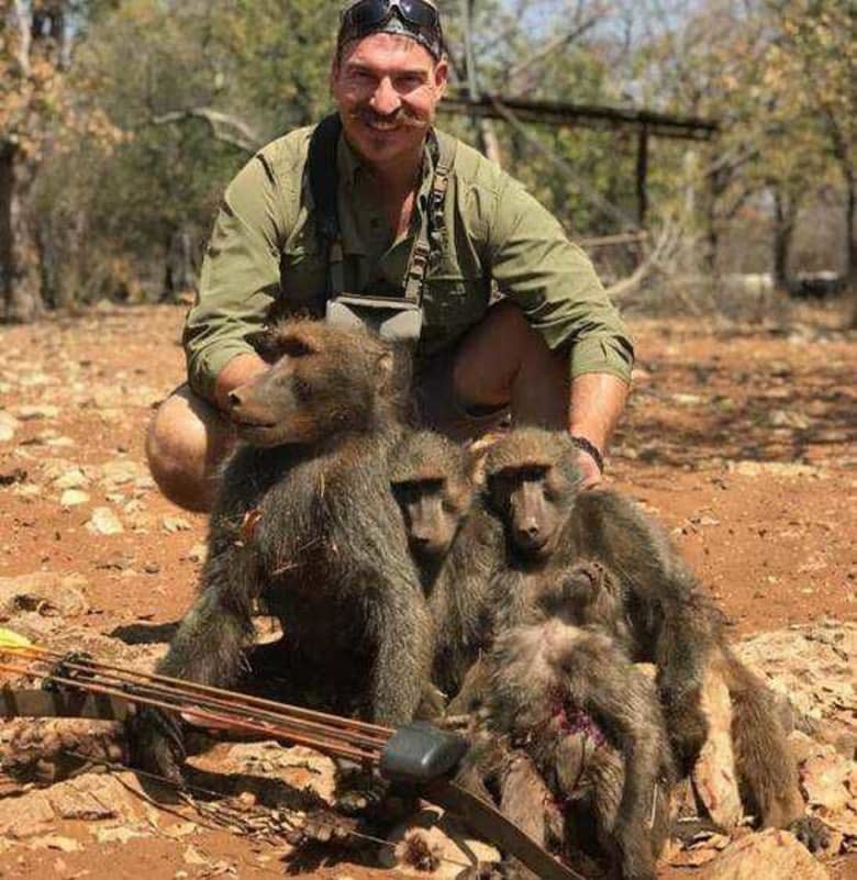 Idaho Fish and Game Commissioner Blake Fischer poses with "a whole family of baboons" that he said he killed in Africa. (Photo: IDAHO'S OFFICE OF THE GOVERNOR)