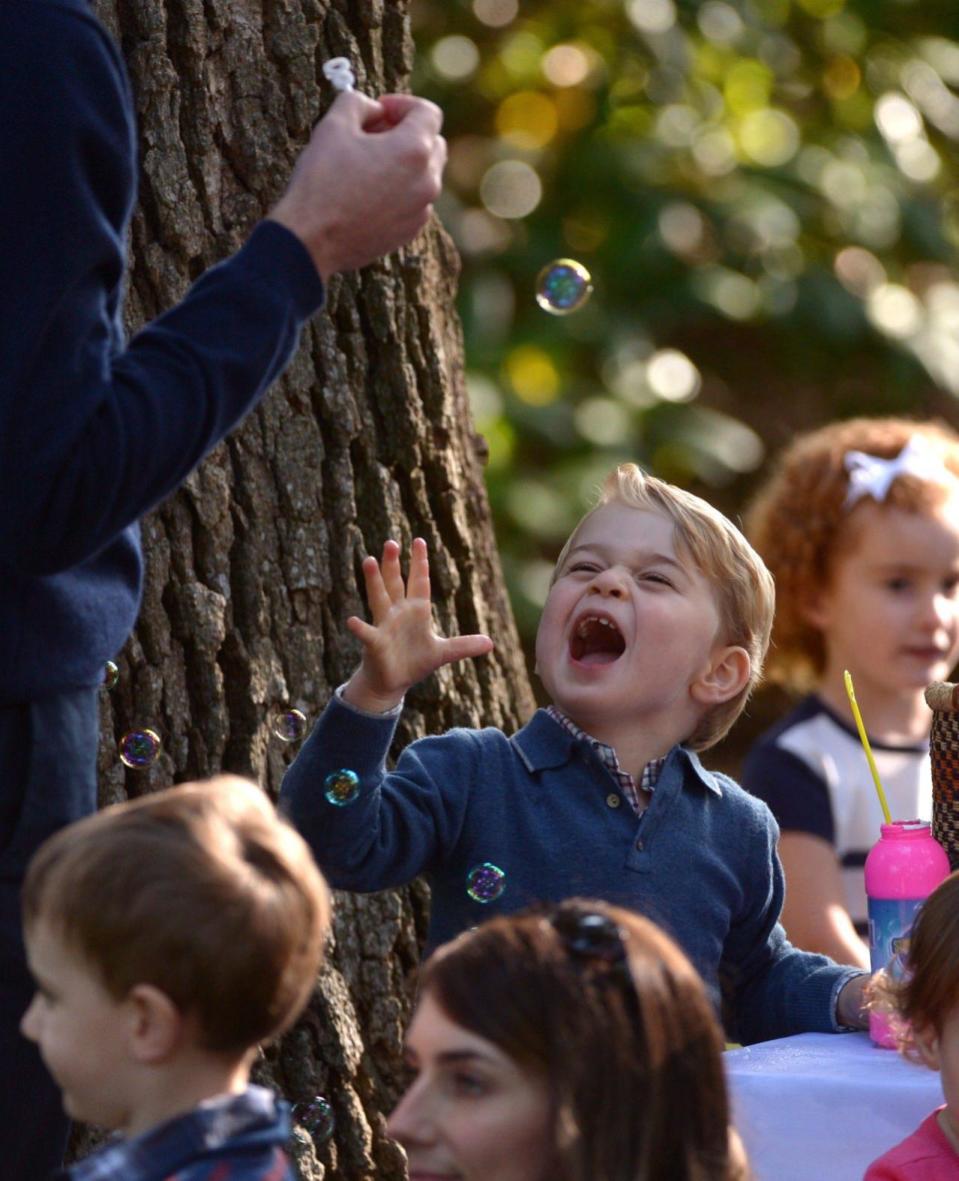 Prince George plays with bubbles during a children’s tea party at Government House in Victoria, Thursday, Sept. 29, 2016. THE CANADIAN PRESS/Jonathan Hayward