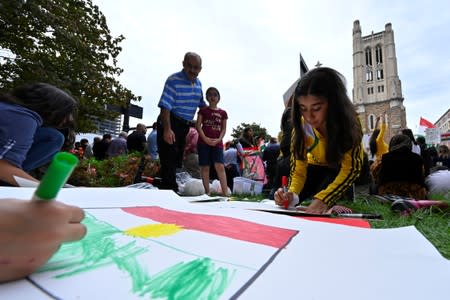 A crowd of over 500 people protest in support of Kurds after the Trump administration changed its policy in Syria