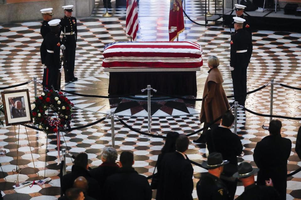 Mourners gather to view the casket of John Glenn as he lies in honor, Friday, Dec. 16, 2016, in Columbus, Ohio. Glenn's home state and the nation began saying goodbye to the famed astronaut who died last week at the age of 95. (AP Photo/John Minchillo)