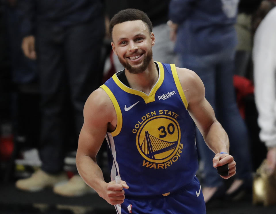 Golden State Warriors guard Stephen Curry reacts at the end of Game 4 of the NBA basketball playoffs Western Conference finals against the Portland Trail Blazers, Monday, May 20, 2019, in Portland, Ore. The Warriors won 119-117 in overtime. (AP Photo/Ted S. Warren)