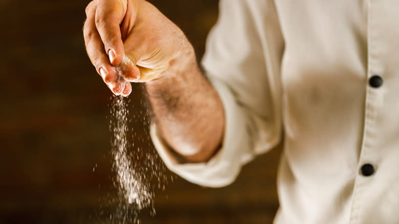 hand sprinkling salt