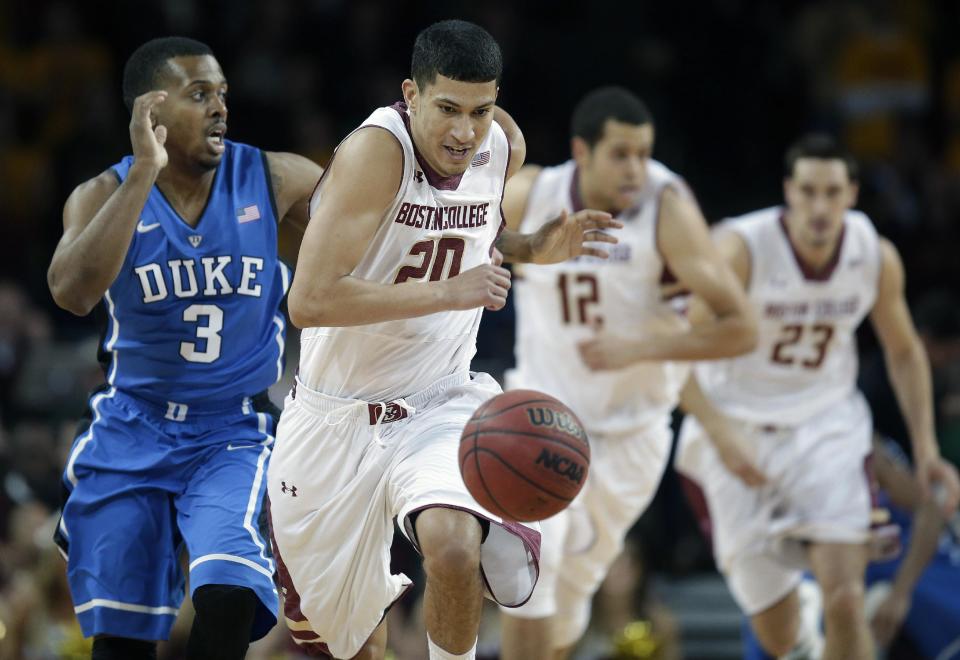 Boston College guard Lonnie Jackson (20) closes in on a loose ball ball as Duke guard Tyler Thornton (3) pursues during the first half of their NCAA mens college basketball game on the Boston College campus in Boston, Saturday, Feb. 8, 2014. Boston College forwards Ryan Anderson (12) and Alex Dragicevich (23) follow the play up court. (AP Photo/Stephan Savoia)