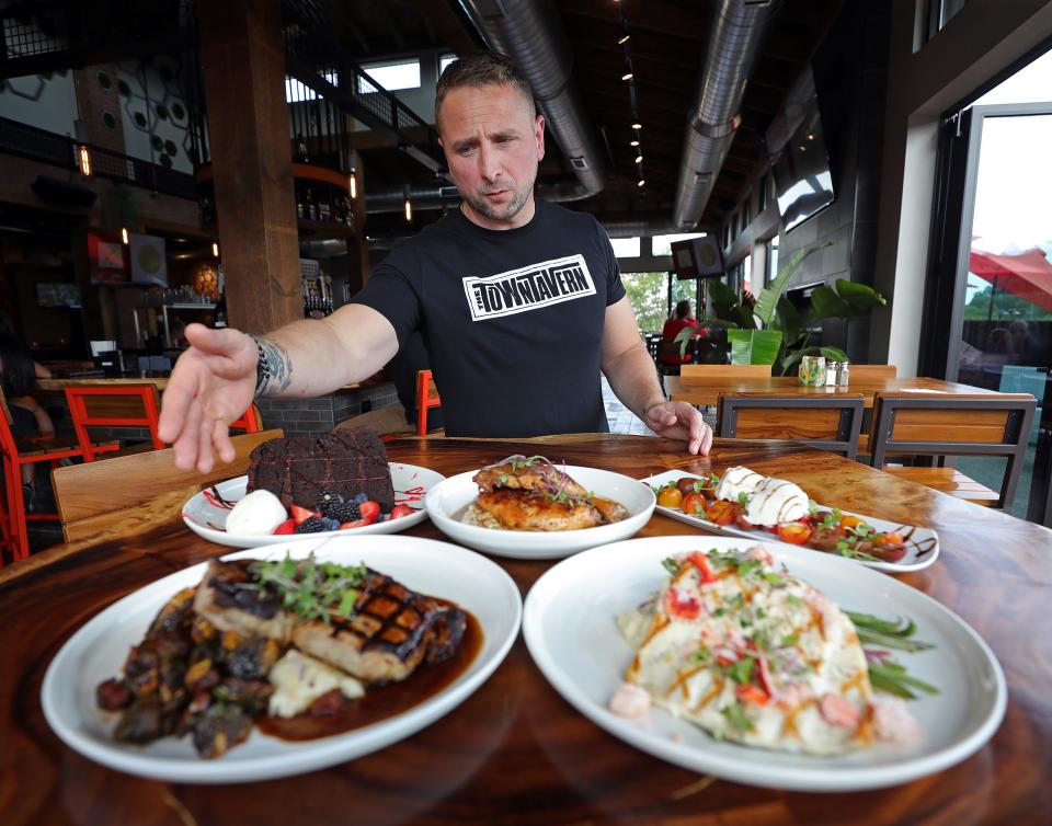 Chef Lee Turano talks about a selection of dishes he and his team made at Town Tavern Wednesday, Sept. 20, 2023, in Copley, Ohio.