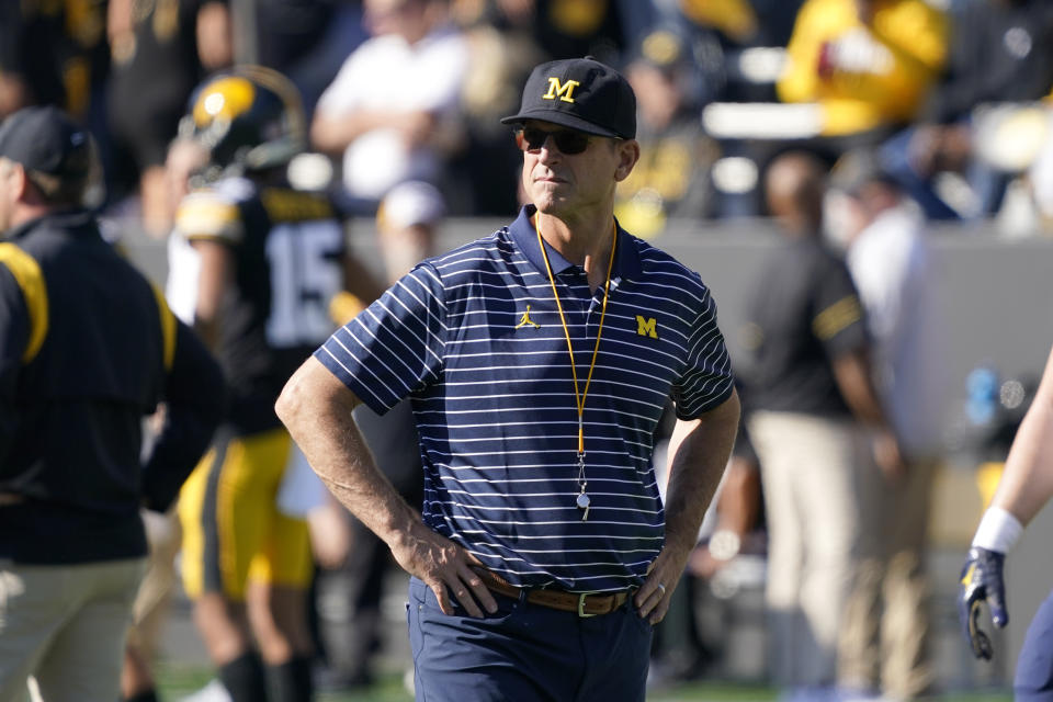 FILE - Michigan head coach Jim Harbaugh watches his team warm up before an NCAA college football game against Iowa, Saturday, Oct. 1, 2022, in Iowa City, Iowa. (AP Photo/Charlie Neibergall, File)